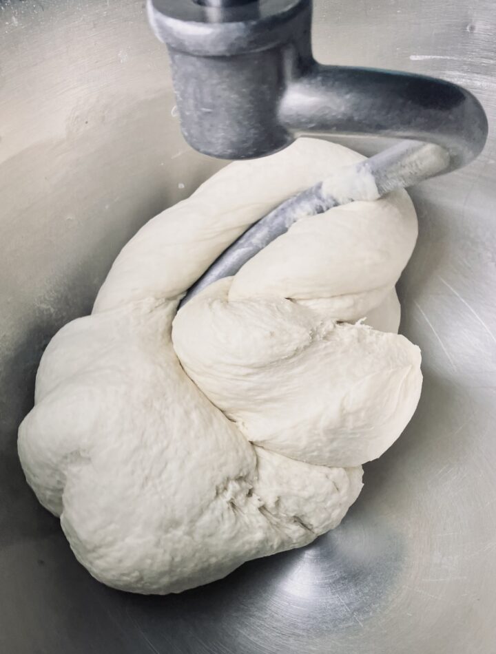 firm dough being kneaded in a stand mixer